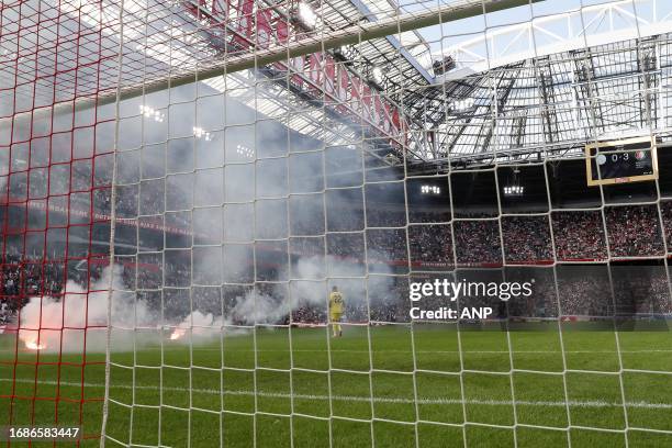 Fireworks on the field at 0-3, the match is stopped during the Dutch Eredivisie match between Ajax and Feyenoord in the Johan Cruijff ArenA on...