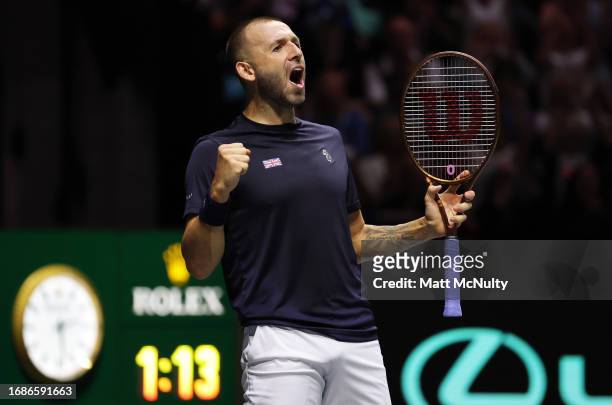 Daniel Evans of Great Britain celebrates after winning the second set against Arthur Fils of France during the Davis Cup Finals Group Stage at AO...