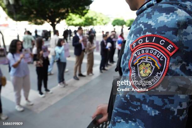 Armenian police officers continue to take security measures around the entrance to the Government House, during ongoing anti-government protests in...