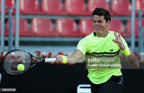 Milos Raonic of Canada plays a forehand against Philipp Kohlschreiber of Germany in their first round match during day two of the Internazionali BNL...