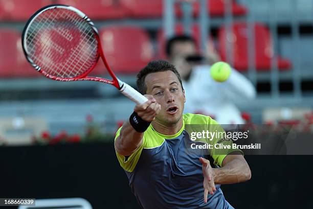 Philipp Kohlschreiber of Germany plays a forehand against Milos Raonic of Canada in their first round match during day two of the Internazionali BNL...