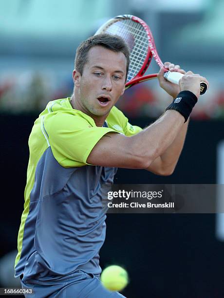 Philipp Kohlschreiber of Germany plays a backhand against Milos Raonic of Canada in their first round match during day two of the Internazionali BNL...