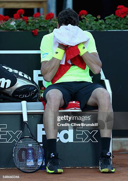 Milos Raonic of Canada shows his frustration at the change of ends against Philipp Kohlschreiber of Germany in their first round match during day two...