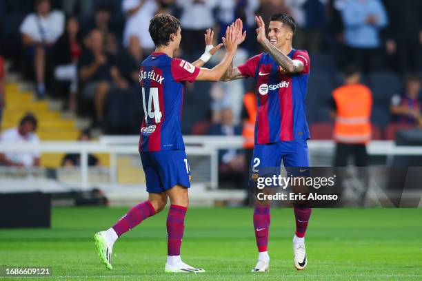 Joao Felix of FC Barcelona celebrates with Joao Cancelo of FC Barcelona after scoring the team's first goal during the LaLiga EA Sports match between...
