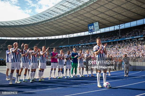 Haris Tabakovic and layers of Hertha BSC celebrate with the fans after the Second Bundesliga match between Hertha BSC and Eintracht Braunschweig at...