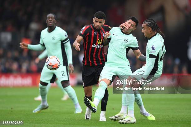 Dominic Solanke of AFC Bournemouth is challenged by Enzo Fernandez of Chelsea during the Premier League match between AFC Bournemouth and Chelsea FC...