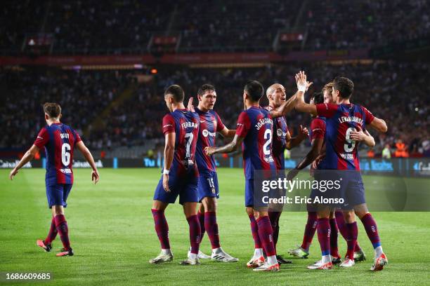 Robert Lewandowski of FC Barcelona celebrates with his teammates after scoring the team's second goal during the LaLiga EA Sports match between FC...