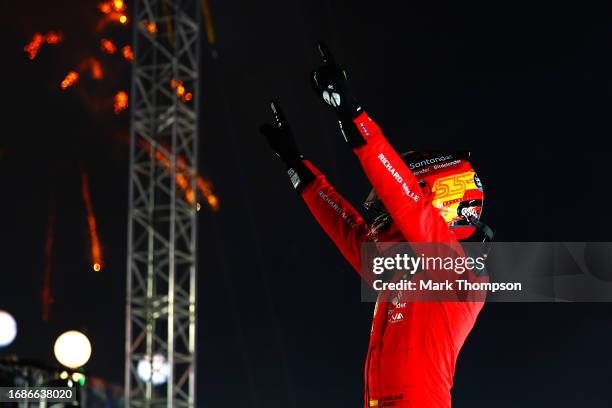 Race winner Carlos Sainz of Spain and Ferrari celebrates in parc ferme during the F1 Grand Prix of Singapore at Marina Bay Street Circuit on...