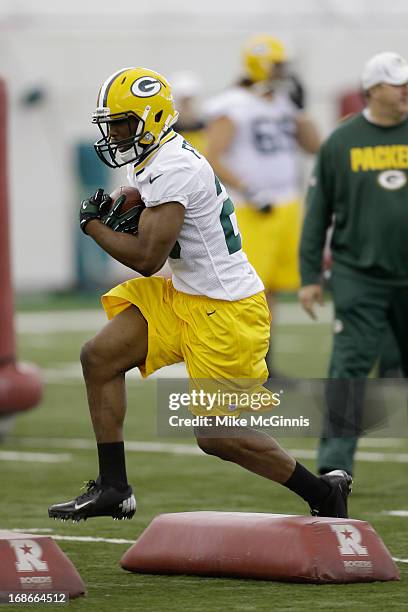 Johnathan Franklin of the Green Bay Packers runs through drills during rookie camp at the Don Hutson Center on May 10, 2013 in Green Bay, Wisconsin.