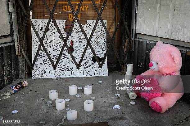 Memorial sits outside a shuttered bakery near the location where a 20-year-old man died from a gunshot wound to the head and a 15-year-old boy was...