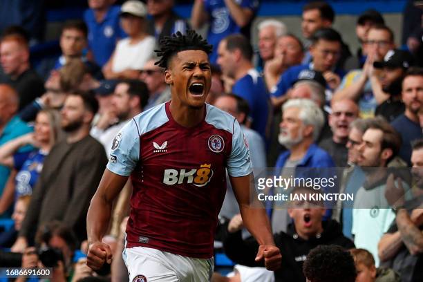 Aston Villa's English striker Ollie Watkins celebrates after scoring the opening goal of the English Premier League football match between Chelsea...