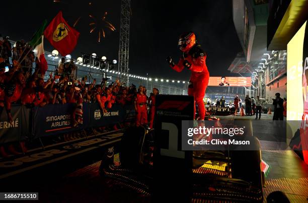 Race winner Carlos Sainz of Spain and Ferrari celebrates in parc ferme during the F1 Grand Prix of Singapore at Marina Bay Street Circuit on...