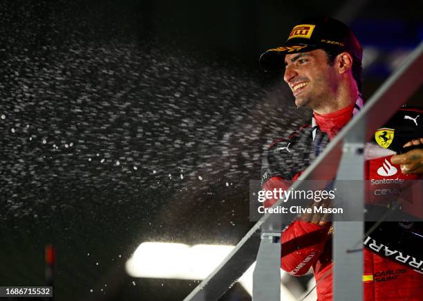 Race winner Carlos Sainz of Spain and Ferrari celebrates on the podium during the F1 Grand Prix of Singapore at Marina Bay Street Circuit on...