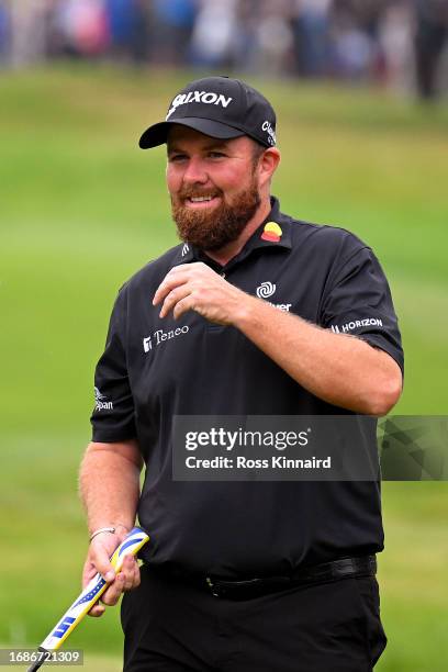 Shane Lowry of Ireland smiles upon finishing his round on the 18th green during Day Four of the BMW PGA Championship at Wentworth Golf Club on...