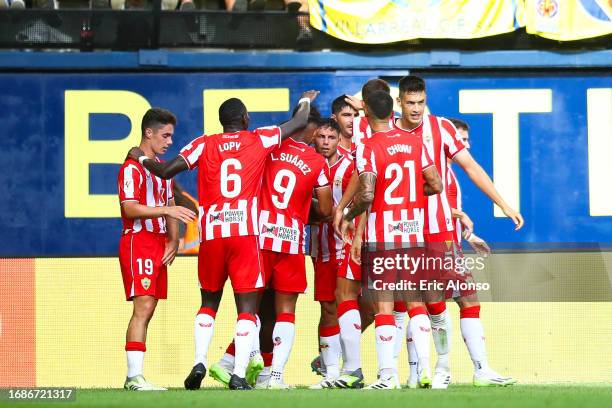 Sergio Akieme of UD Almeria celebrates with his teammates after scoring the team's first goal during the LaLiga EA Sports match between Villarreal CF...