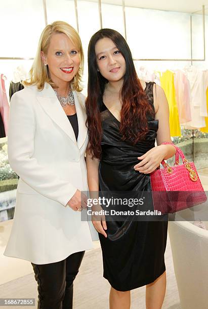 Susan Franklin and Jing Tian attend Dior celebrates the opening of Dior Couture Patrick Demarchelier Exhibition at the Dior store at South Coast...