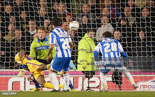 Wilfried Zaha of Crystal Palace heads past Tomasz Kuszczak of Brighton to score during the npower Championship Play Off Semi Final Second Leg between...