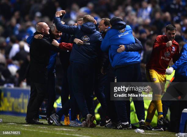 Crystal Palace manager Ian Holloway and his bench celebrate during the npower Championship Play Off Semi Final Second Leg between Brighton & Hove...
