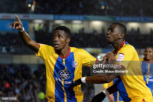 Wilfried Zaha of Crystal Palace celebrates with team-mate Yannick Bolasie after scoring his first goal during the npower Championship play off semi...