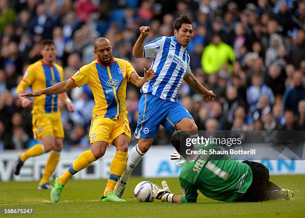 Leonardo Ulloa of Brighton & Hove Albion is tackled by Danny Gabbidon and goalkeeper Julian Speroni of Crystal Palace during the npower Championship...