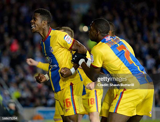 Wilfried Zaha of Crystal Palace celebrates with team-mate Yannick Bolasie after scoring his first goal during the npower Championship play off semi...