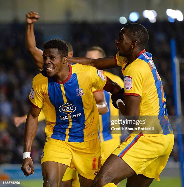 Wilfried Zaha of Crystal Palace celebrates with team-mate Yannick Bolasie after scoring his first goal during the npower Championship play off semi...