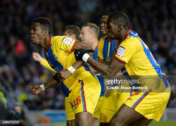Wilfried Zaha of Crystal Palace celebrates with team-mate Yannick Bolasie after scoring his first goal during the npower Championship play off semi...