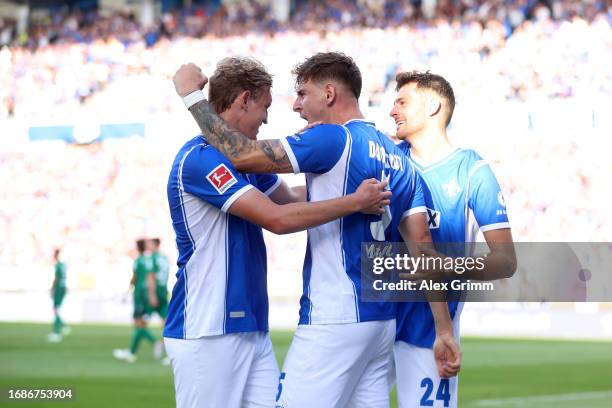 Matej Maglica of SV Darmstadt 98 celebrates with teammates after scoring the team's second goal during the Bundesliga match between SV Darmstadt 98...