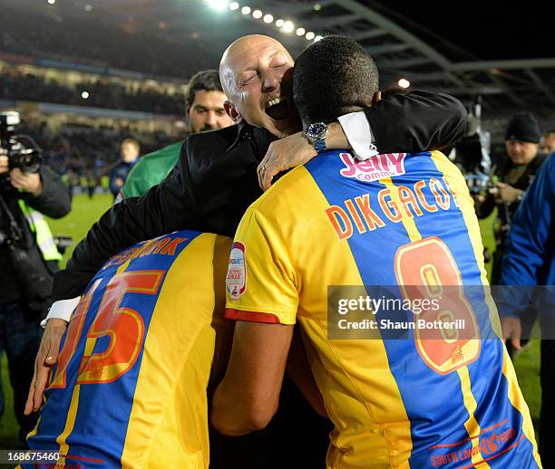 Ian Holloway the Crystal Palace manager celebrates with Kagisho Dikgacoi and Mile Jedinak after winning the npower Championship play off semi final...