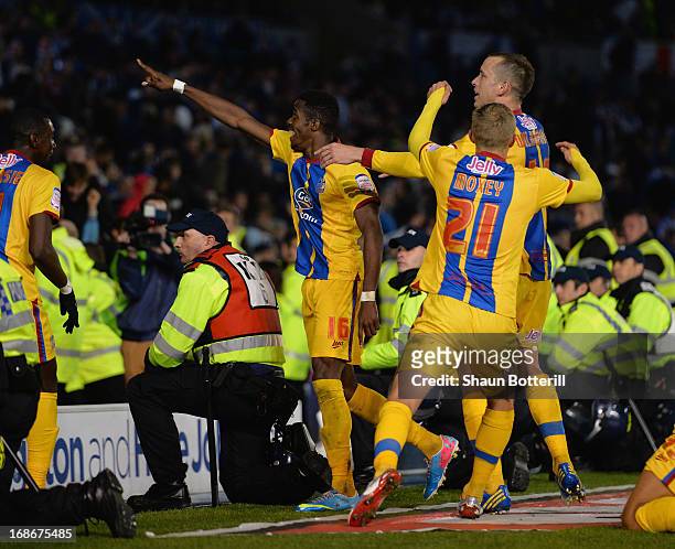Wilfried Zaha of Crystal Palace celebrates his second goal amongst the police during the npower Championship play off semi final second leg between...