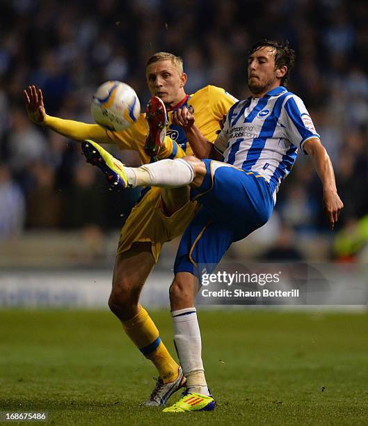 Will Buckley of Brighton & Hove Albion is tackled by Danny Gabbidon Dean Moxey of Crystal Palace during the npower Championship play off semi final...