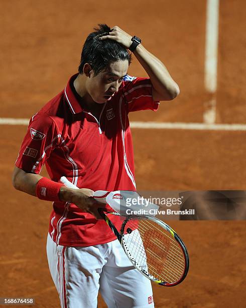 Kei Nishikori of Japan shows his emotions against Paolo Lorenzi of Italy in their first round match during day two of the Internazionali BNL d'Italia...