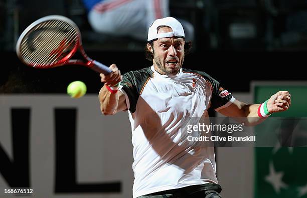 Paolo Lorenzi of Italy plays a forehand against Kei Nishikori of Japan in their first round match during day two of the Internazionali BNL d'Italia...