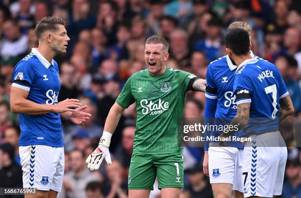 Jordan Pickford of Everton speaks with teammates during the Premier League match between Everton FC and Arsenal FC at Goodison Park on September 17,...