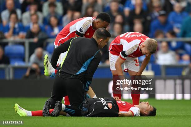 Gabriel Martinelli of Arsenal receives medical treatment after sustaining an injury during the Premier League match between Everton FC and Arsenal FC...