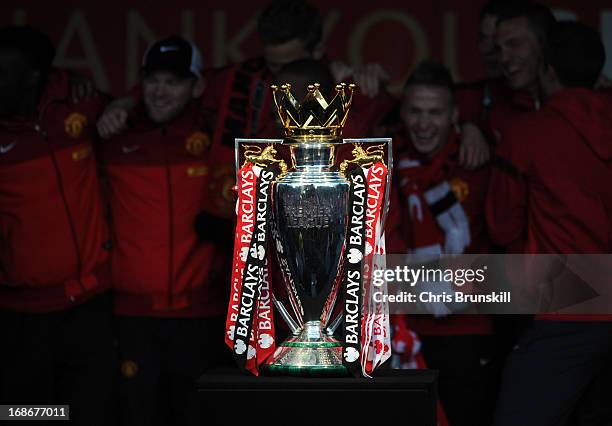 Manchester United celebrate behind the Barclays Premier League trophy during the Manchester United Premier League Winners Parade at Manchester Town...