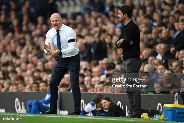Sean Dyche, Manager of Everton, reacts alongside Mikel Arteta, Manager of Arsenal, during the Premier League match between Everton FC and Arsenal FC...