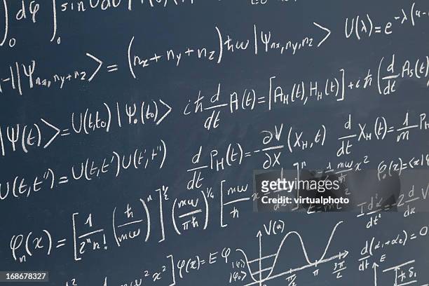 blackboard full of equations - physics equation stock pictures, royalty-free photos & images