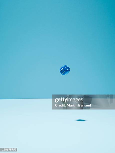 blue dice in mid-air - ace stock pictures, royalty-free photos & images