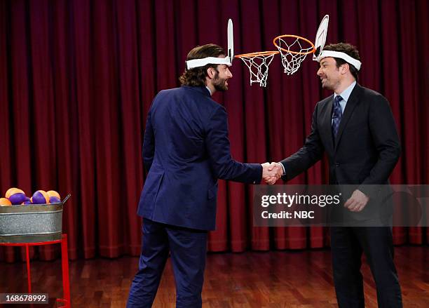 Episode 834 -- Pictured: Bradley Cooper and host Jimmy Fallon playing a game on May 13, 2013 -- (Photo by: Lloyd Bishop/NBC/NBCU Photo Bank via Getty...