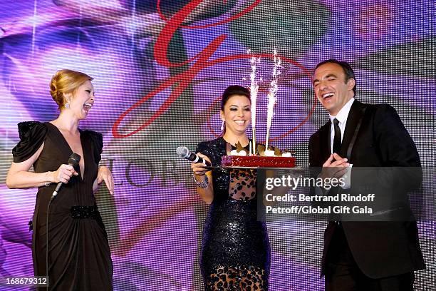 Singer Lara Fabian and Eva Longoria give a Birthday Cake to Nikos Aliagas which has 44 years old today - 'Global Gift Gala' at Hotel George V on May...