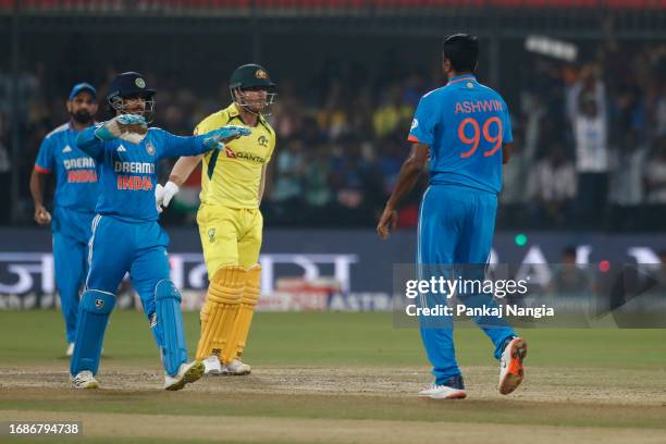 Ravichandran Ashwin of India celebrates the wicket of wicket of David Warner of Australia during game two of the One Day International series between...