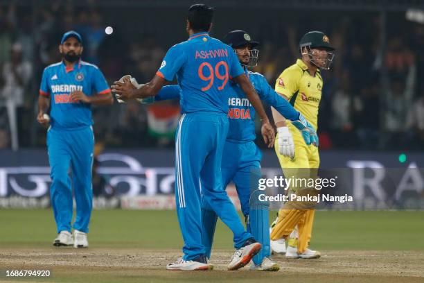 Ravichandran Ashwin of India celebrates the wicket of wicket of David Warner of Australia during game two of the One Day International series between...