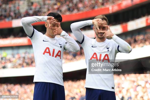 Son Heung-min of Tottenham Hotspur celebrates scoring his 2nd goal with James Maddison during the Premier League match between Arsenal FC and...