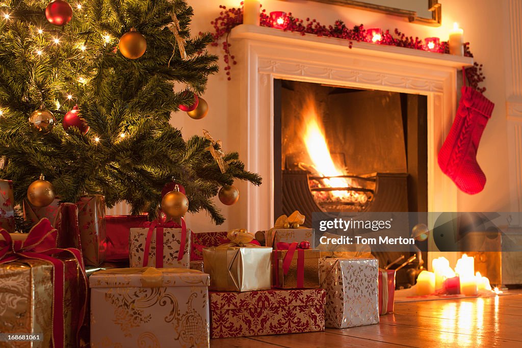 Christmas tree and stocking near fireplace