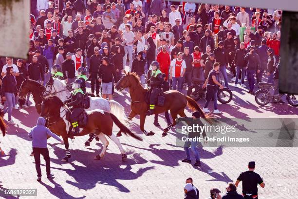 Riots outside the Ajax stadium after the Dutch Eredivisie match between AFC Ajax and Feyenoord at Johan Cruijff Arena on September 24, 2023 in...