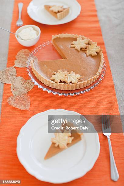 pumpkin pie on table - thanksgiving indulgence stock pictures, royalty-free photos & images