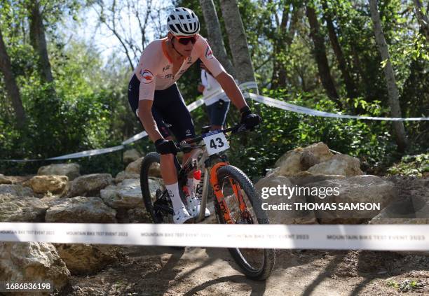 Dutch Mathieu van der Poel competes in the Men's Elite Cross Country mountain biking test event, at Elancourt Hill, in Elancourt, west of Paris, on...