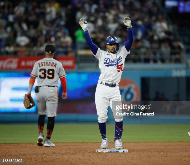 Los Angeles Dodgers Mookie Betts does the Dodger dance jig after hitting a double against the San Francisco Giants at Dodger Stadium on September 23,...