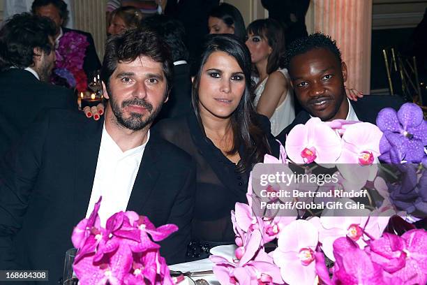 Patrick Fiori, Karine Ferri and Steve Mandanda attend 'Global Gift Gala' at Hotel George V on May 13, 2013 in Paris, France.